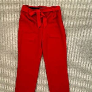 Red slacks with tie belt